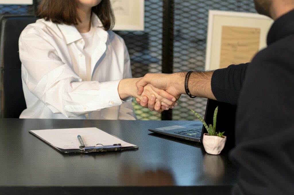 Business buyer and seller shaking hands after a successful deal