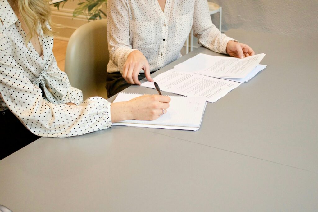 Professional reviewing and signing a business contract - Letter of Intent