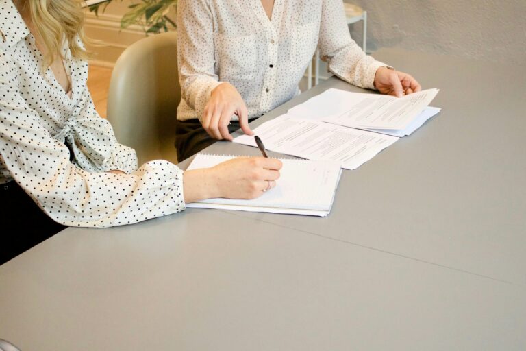 Professional reviewing and signing a business contract - Letter of Intent